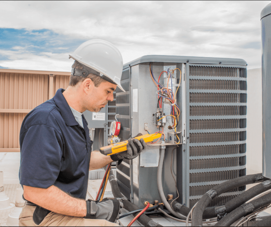 HVAC tech inspecting pilot light