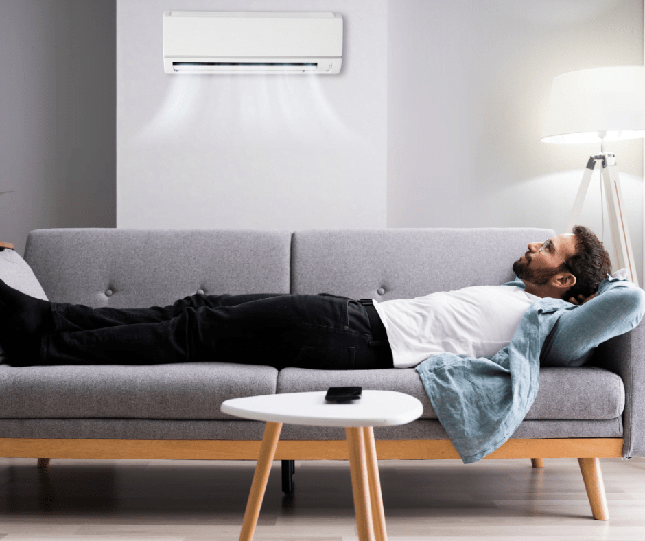 man relaxing in air conditioning after hvac repair work