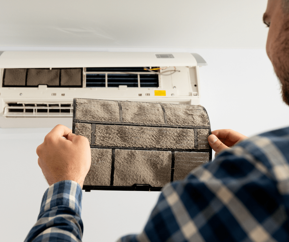 Person Holding a Dirty Air Filter