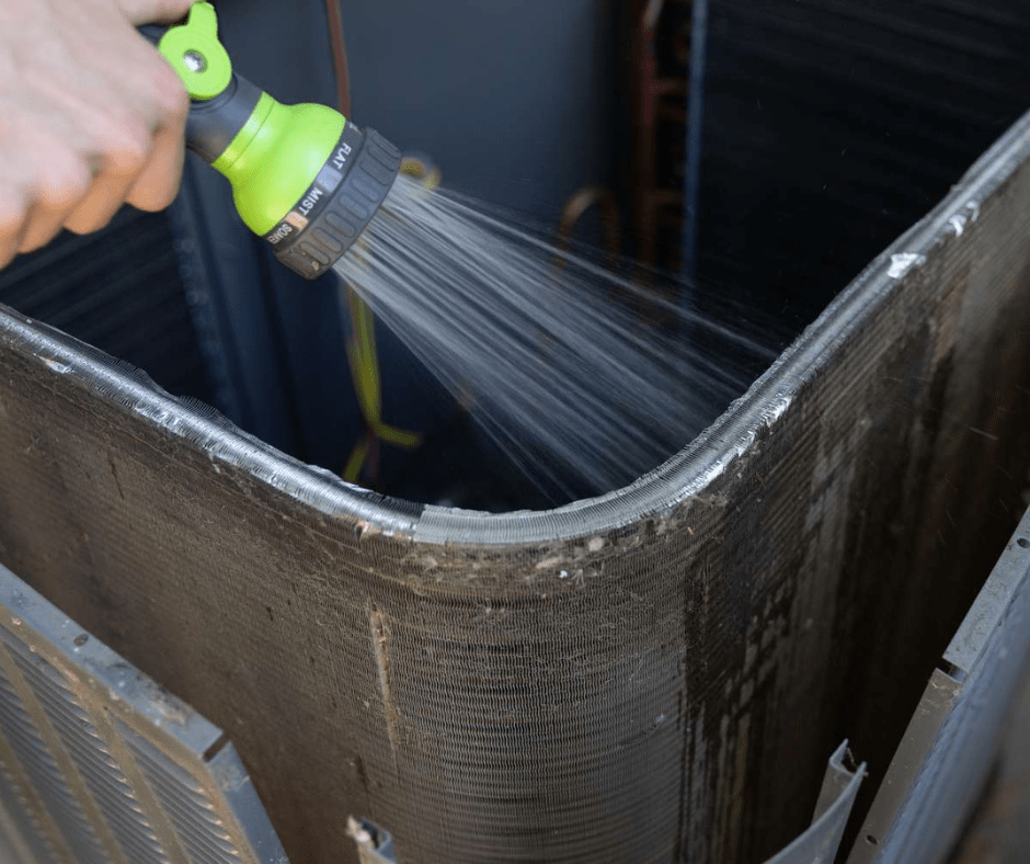 HVAC coil maintenance being performed